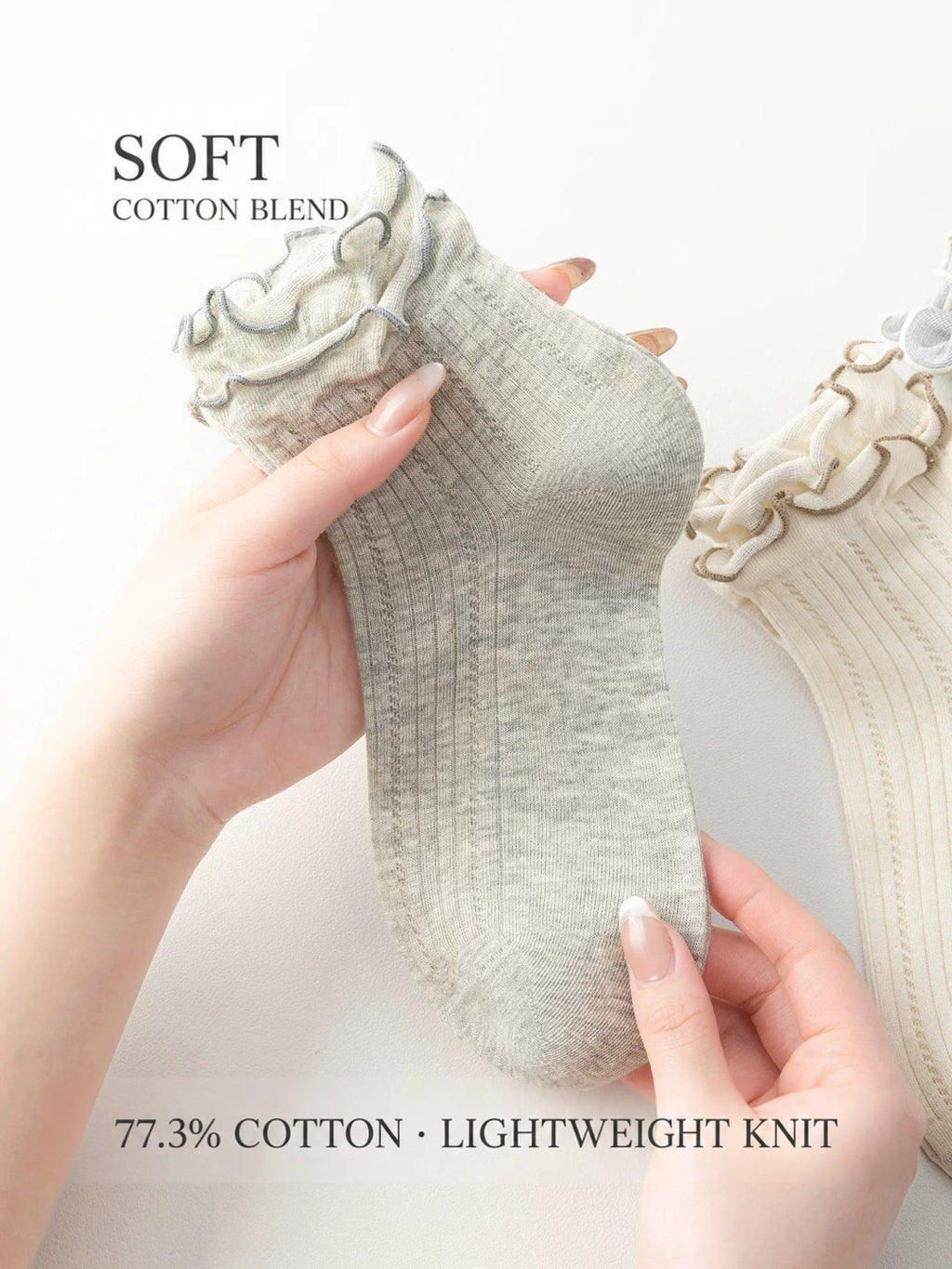 Cotton-blend lightweight knit ankle socks held to show texture
